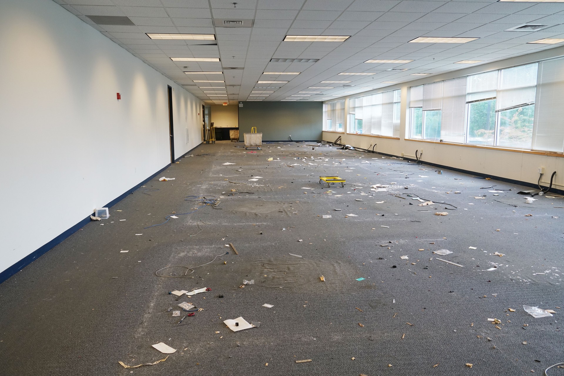 empty office building interior with furniture removed before renovation